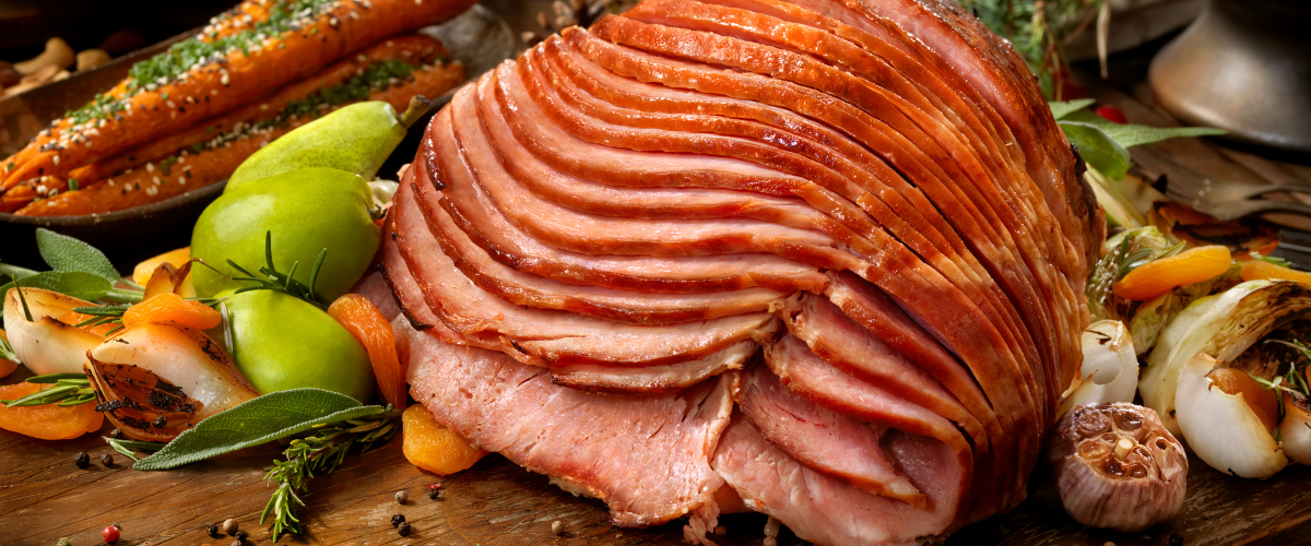sliced ham on a buffet table